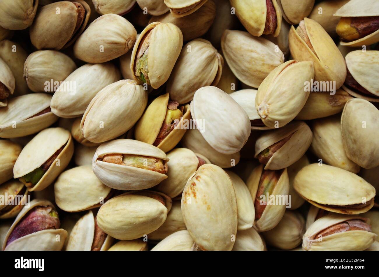Pile of pistachios in the peel close up. Pistachios healthy omega3