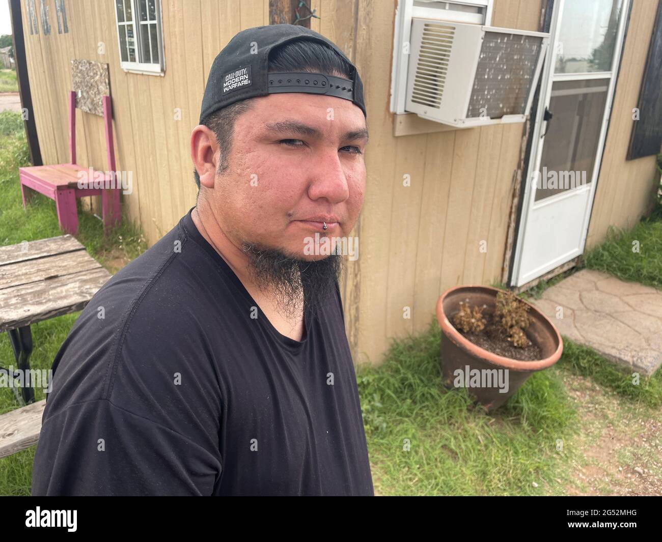 Nick Honesto, who says he will not receive a coronavirus disease (COVID-19) vaccine due to his vaccine hesitancy, poses for a photo in Morton, Texas, U.S., June 23, 2021. Picture taken June 23, 2021. REUTERS/Brad Brooks Stock Photo