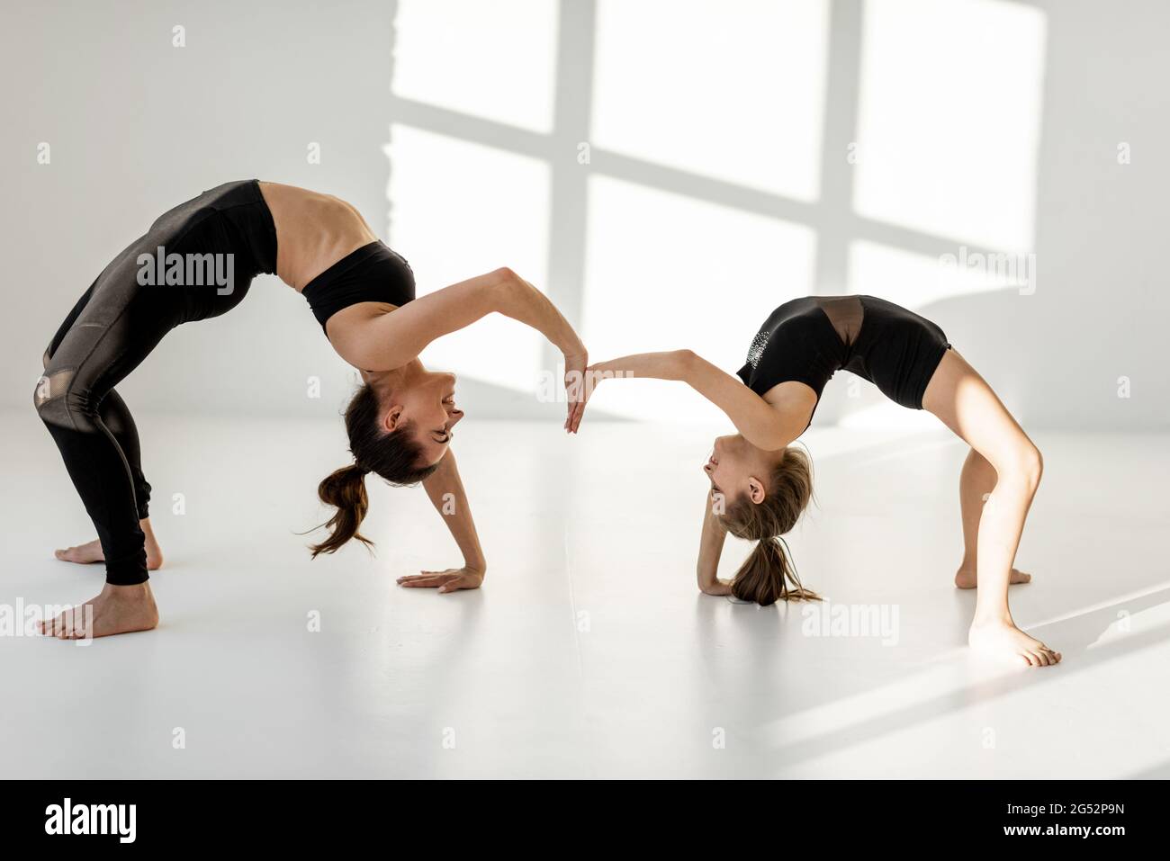 Woman With A Little Girl On Rhythmic Gymnastics Training Stock Photo Woman With A Little Girl On Rhythmic Gymnastics Training Stock Photo