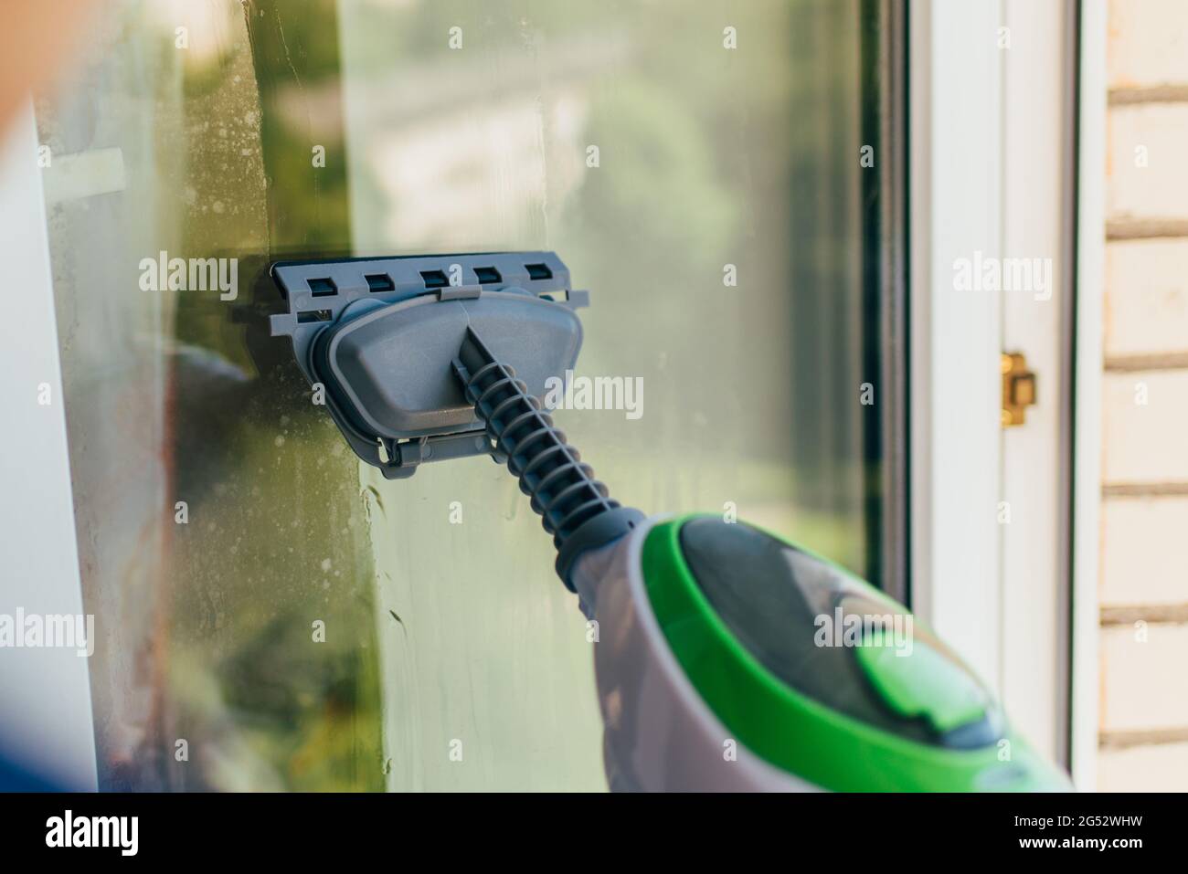 Steam Cleaning Windows with Pressure Editorial Photography - Image