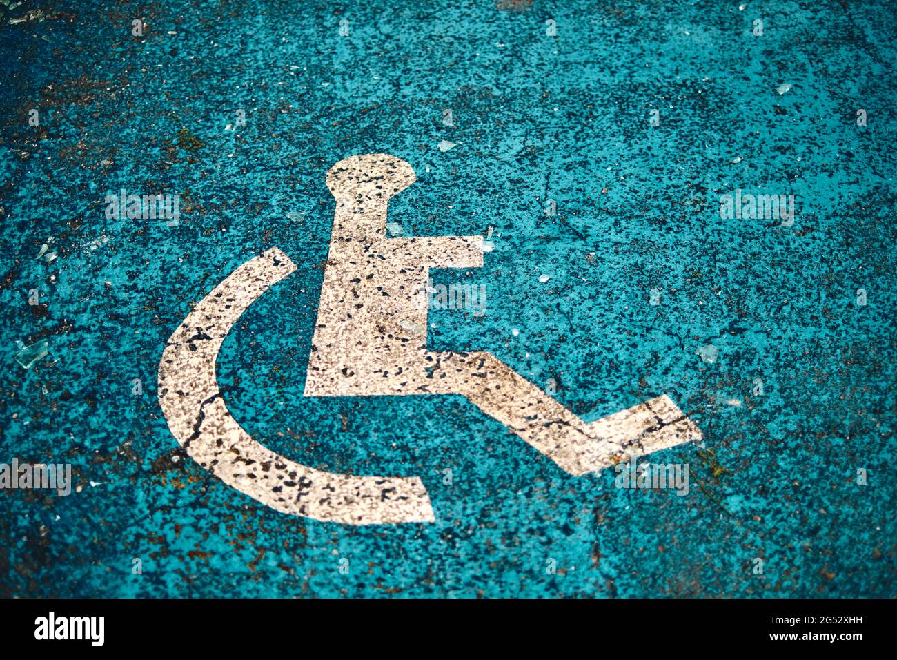 wheelchair lane sign painted on the ground in a disabled parking space. Stock Photo