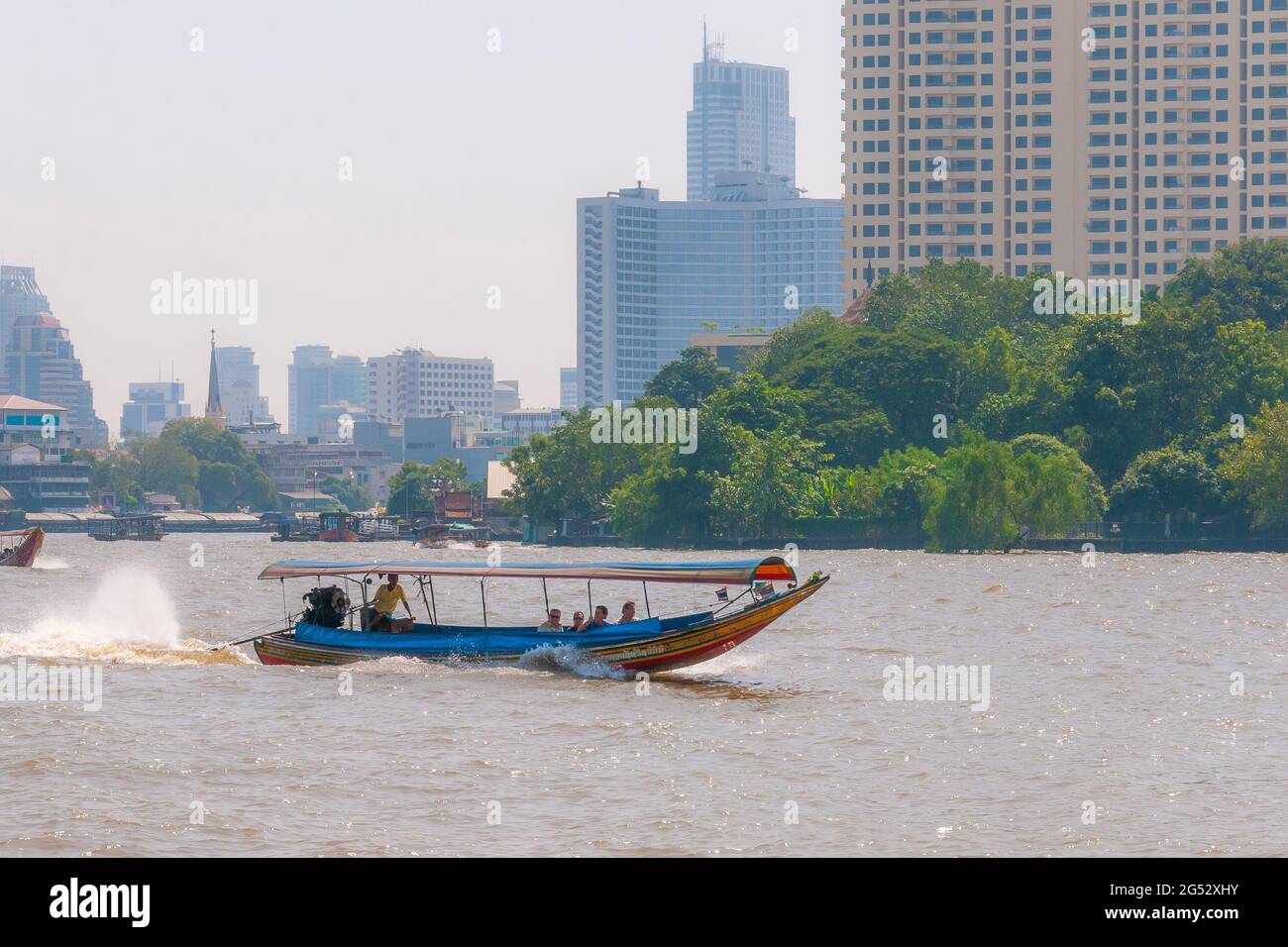 A traditional Thai long-tail boat on the Chao Phraya river in Bangkok in Thailand in South East Asia. Stock Photo