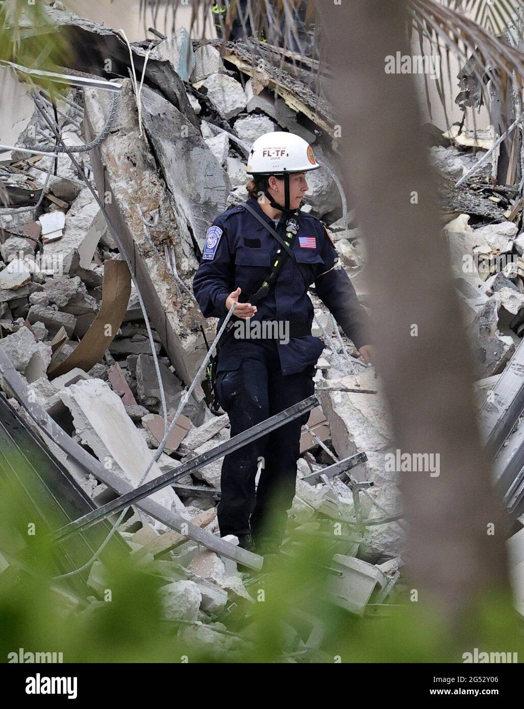 Fire rescue personnel conduct search and rescue in the rubble at ...