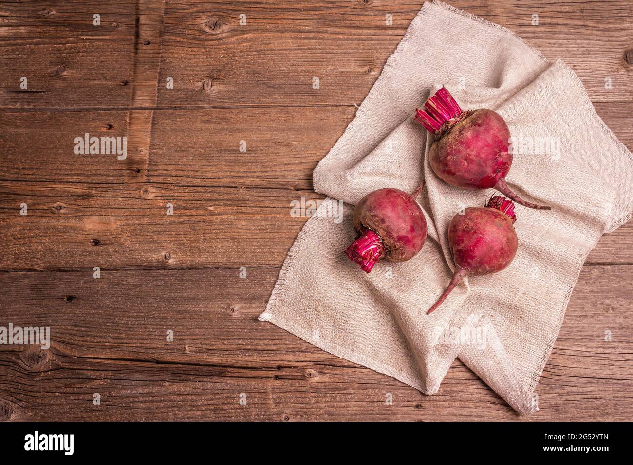Table Beetroot Fresh beetroots on a vintage wooden table. Culinary background ...
