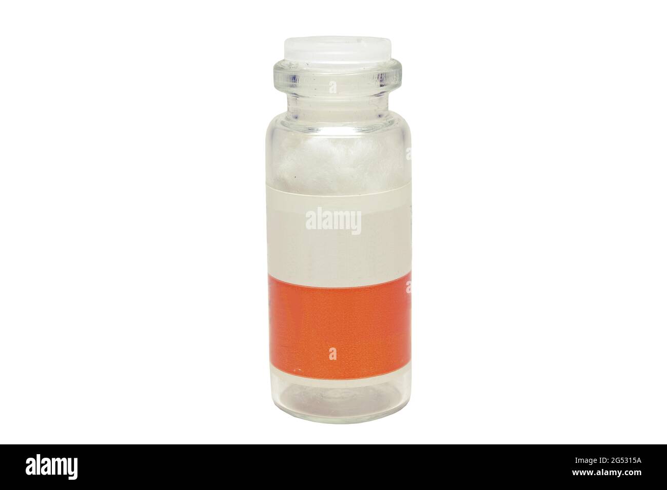 glass medicine bottle with two-color label, plastic lapped stopper, empty, with cotton absorbent inside Stock Photo