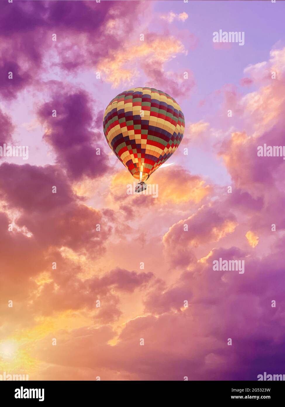 color hot air balloon in blue sky with clouds closeup Stock Photo - Alamy