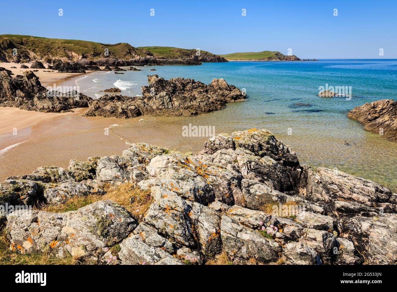 Rocks on scenic beach of golden sands and turquoise sea on Scottish north coast 500. Sango Bay, Durness, Sutherland, Highland, Scotland, UK, Britain Stock Photo