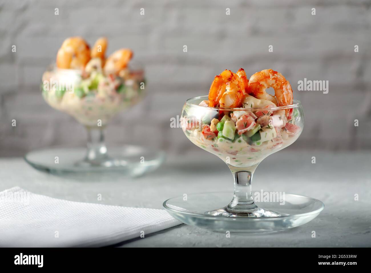 Diet food. Fresh vegetable salad with shrimps. Stock Photo