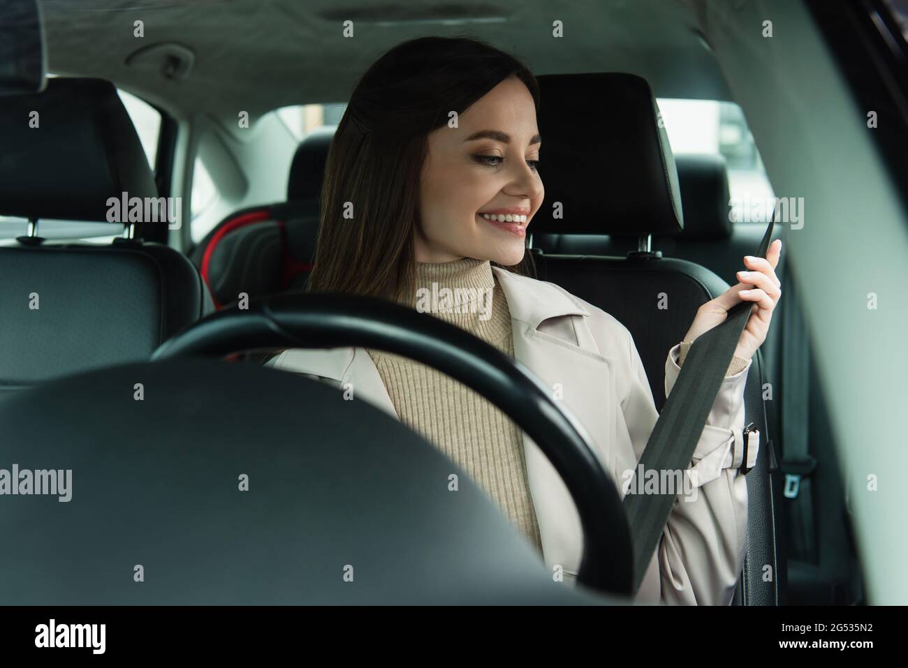 Woman adjusting car seat hi-res stock photography and images - Alamy