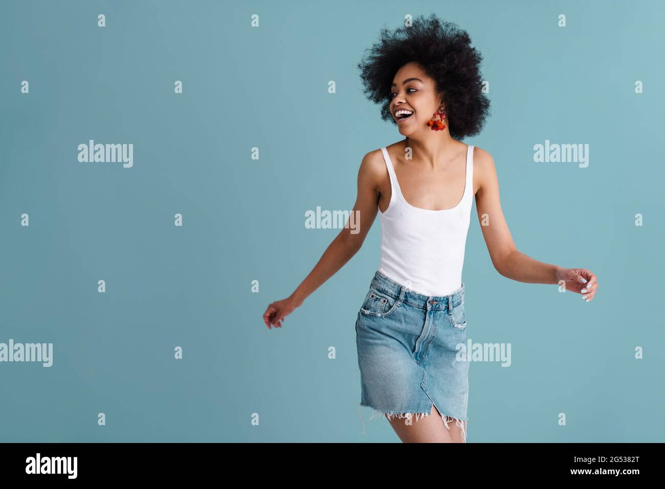 Joyful african american girl laughing while making fun on camera ...