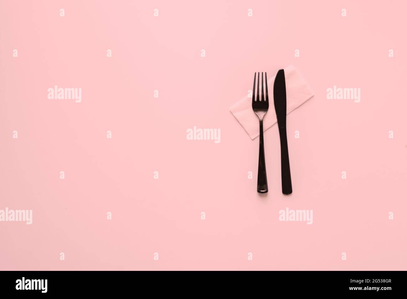 top view conceptual minimalism with plastic table utensil tablewear cultery Stock Photo