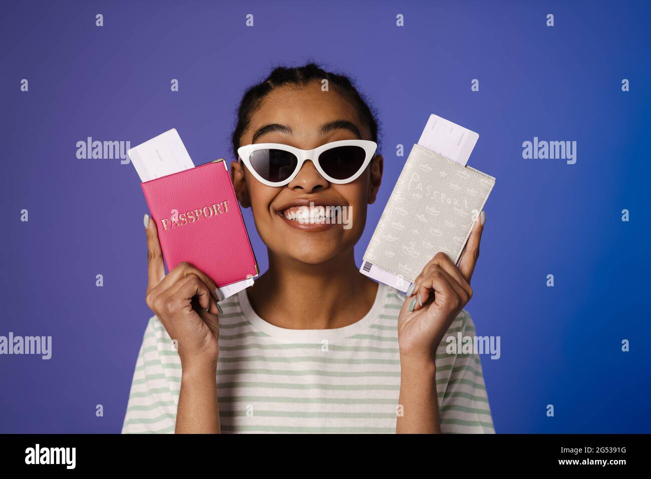 Happy young woman passport hi-res stock photography and images - Alamy
