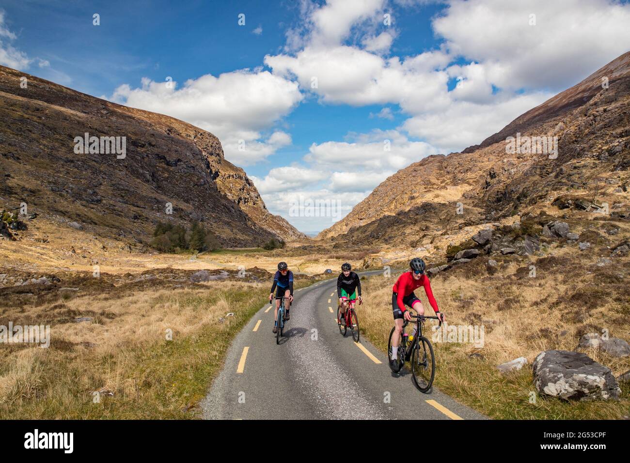 Killarney, Ireland - 14th April 2021: Cyclists on the road through the Gap of Dunloe in Killarney national park. Stock Photo