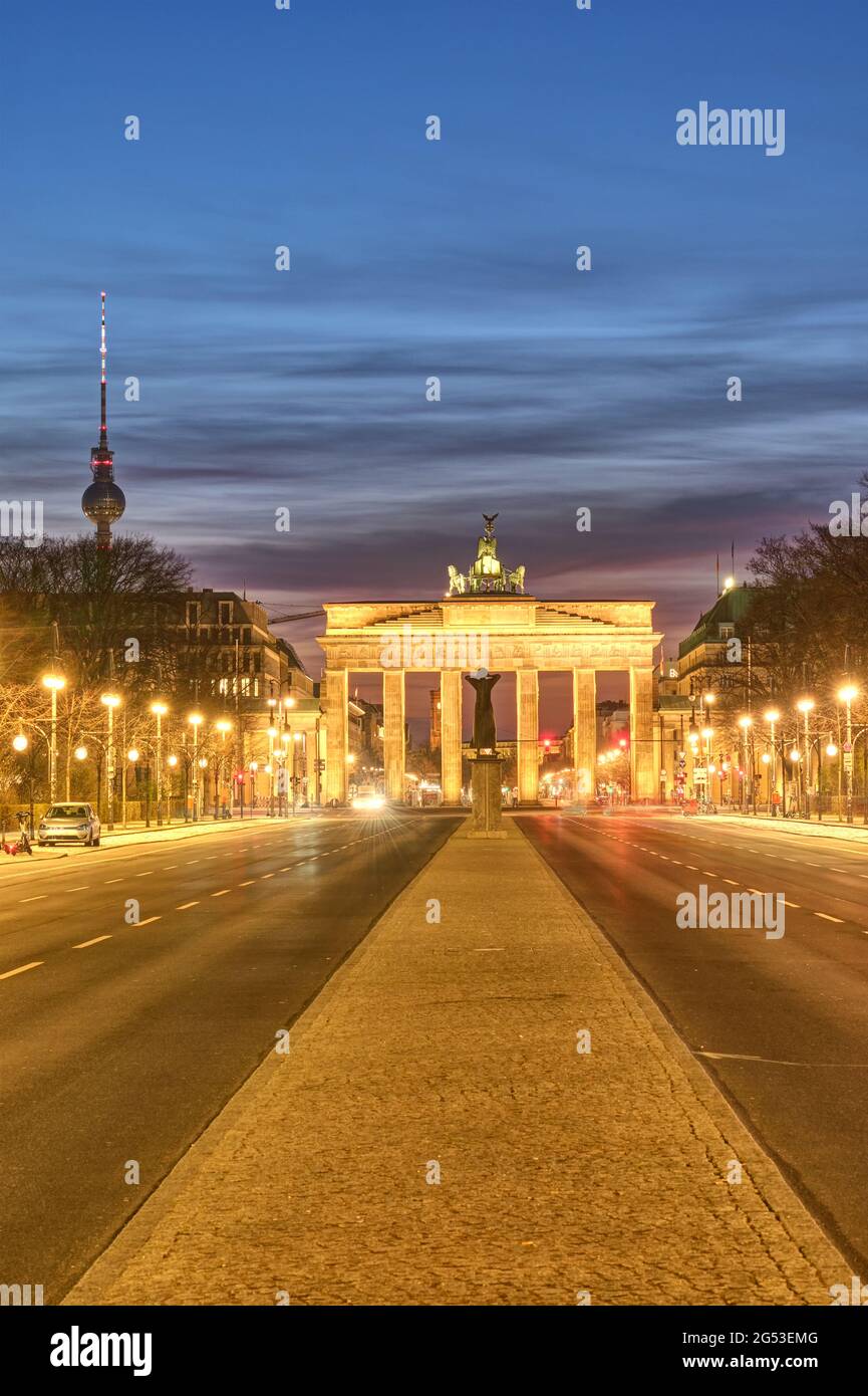 The famous Brandenburger Tor in Berlin with the Television Tower at twilight Stock Photo