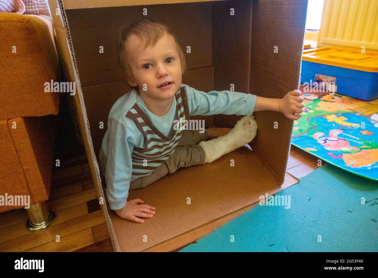 Child with bandage on leg heel fracture. Broken right foot, splint of