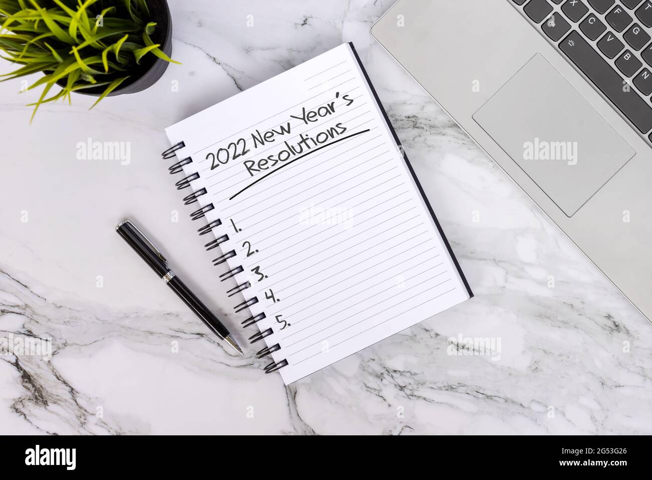 2022 New Year's Resolutions list text on note pad Stock Photo - Alamy