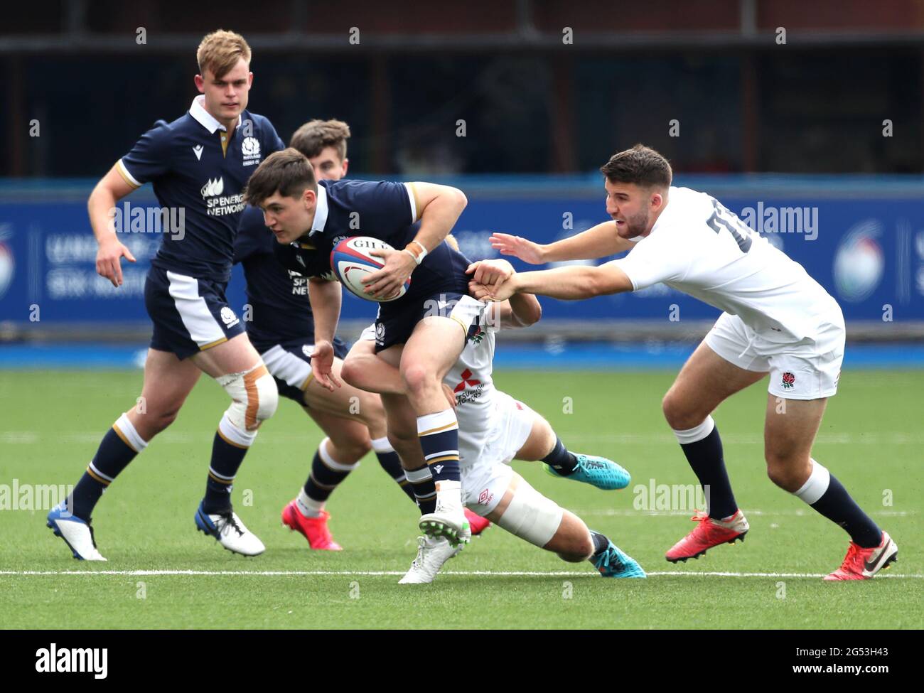 Scotland's Cameron Scott is tackled by England's Tommy Mathews (right) during the Under 20s Six Nations match at Cardiff Arms Park, Cardiff. Picture date: Friday June 25, 2021. Stock Photo