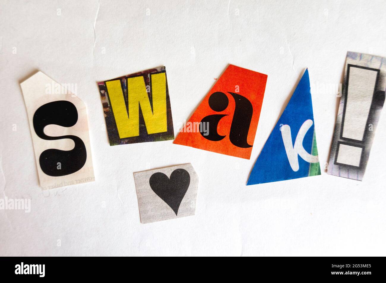 The acronym SWAK is short for 'sealed with a kiss' and is spelled in ransom note style topography, USA Stock Photo