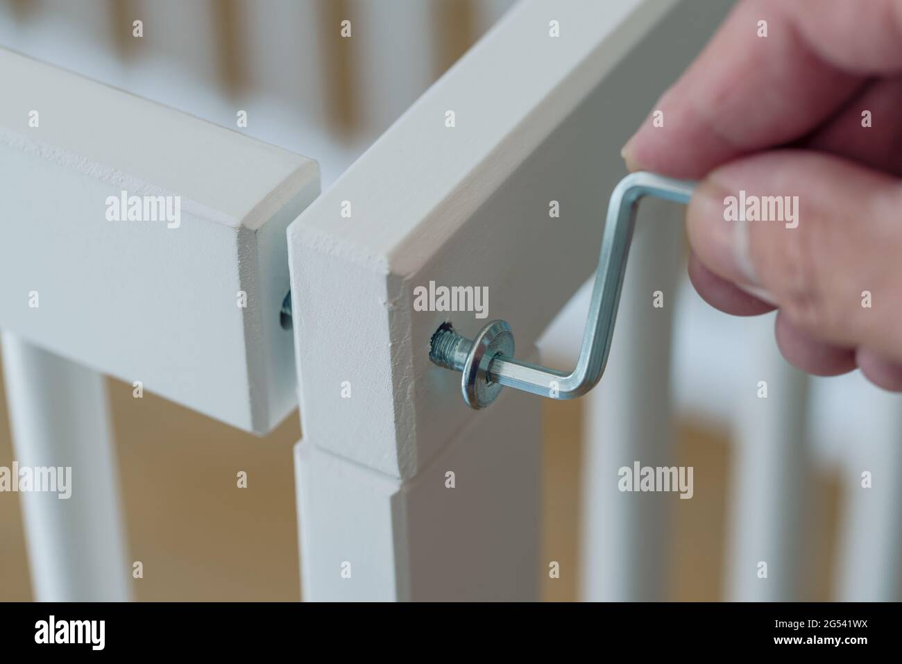 closeup of person assembling furniture using a hex key Stock Photo Alamy