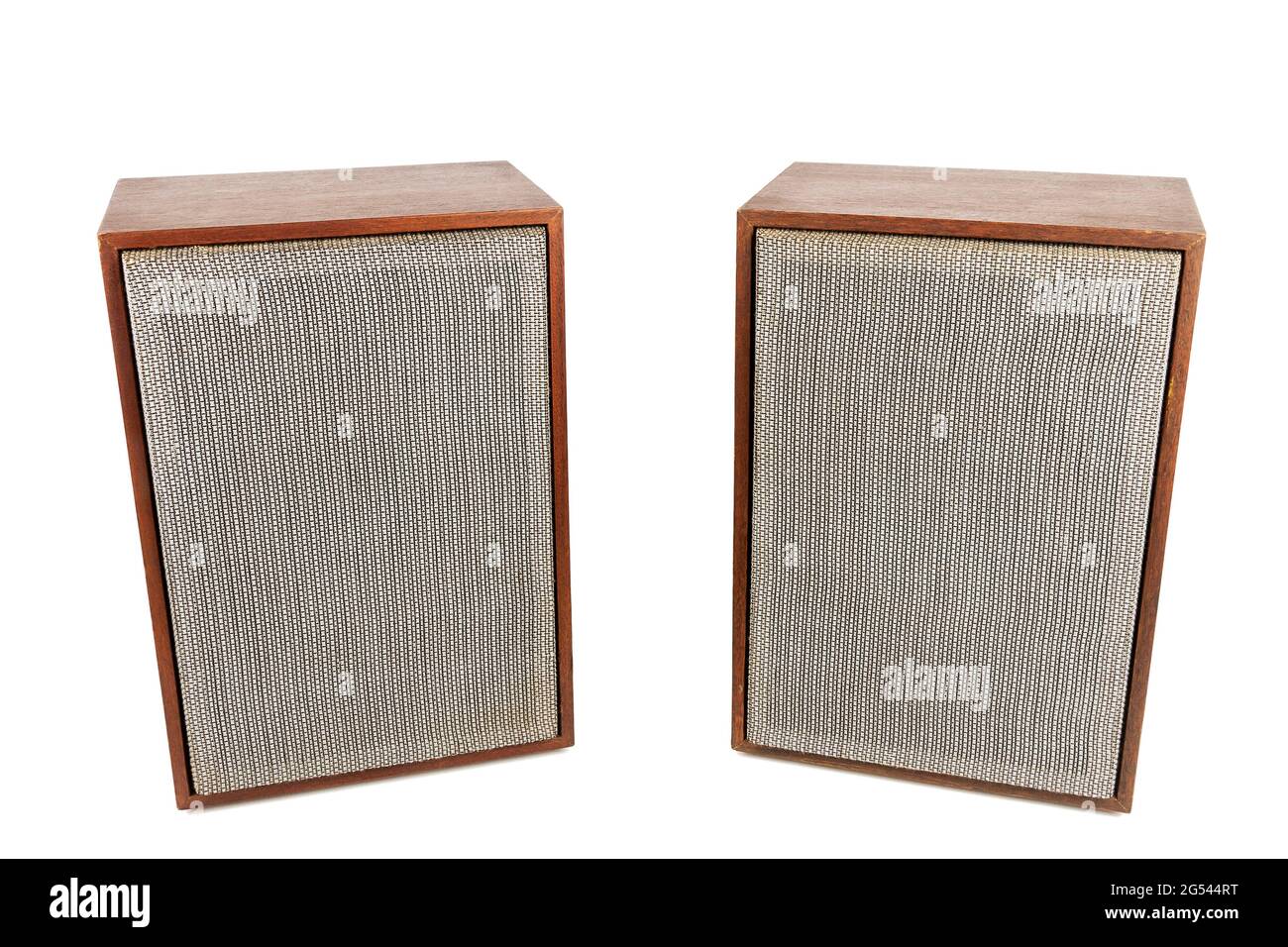 Two vintage speakers with fabric grills isolated on white background