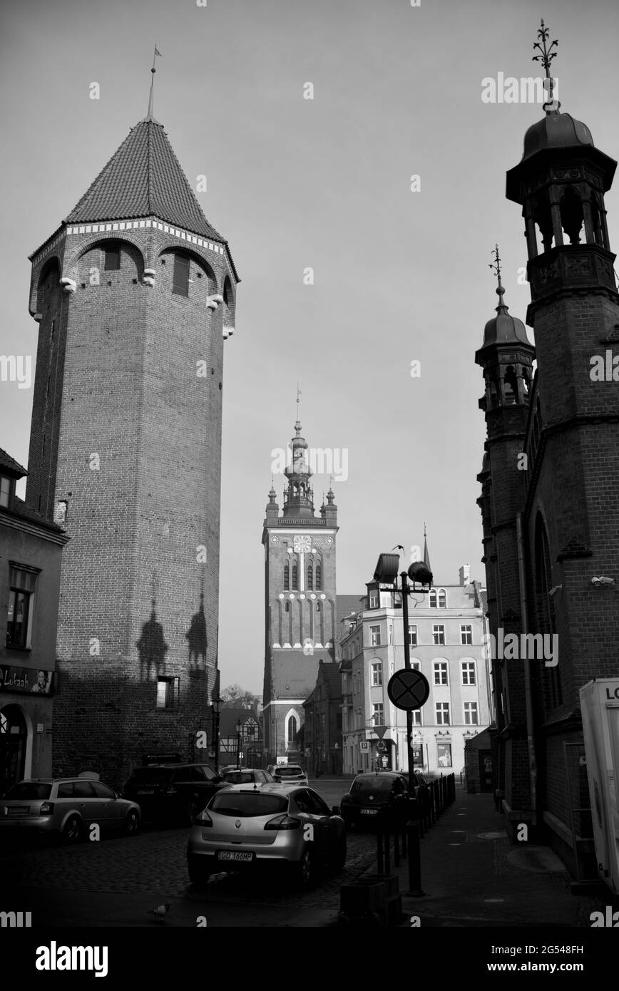 view down Panska street, Hala Targowa on the right, Jacek Tower on the left, looking at St. Catherine's Church, Gdansk, Poland Stock Photo