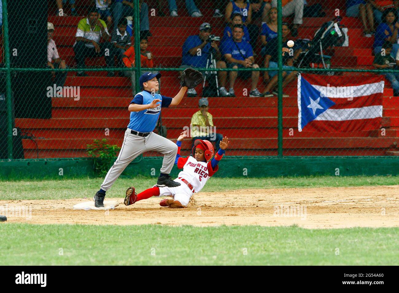 Maracaibo-Zulia-Venezuela-2-9-2007- A child  baseball player from the Guatemala´s team, catches the ball during a small Caribean league game against P Stock Photo