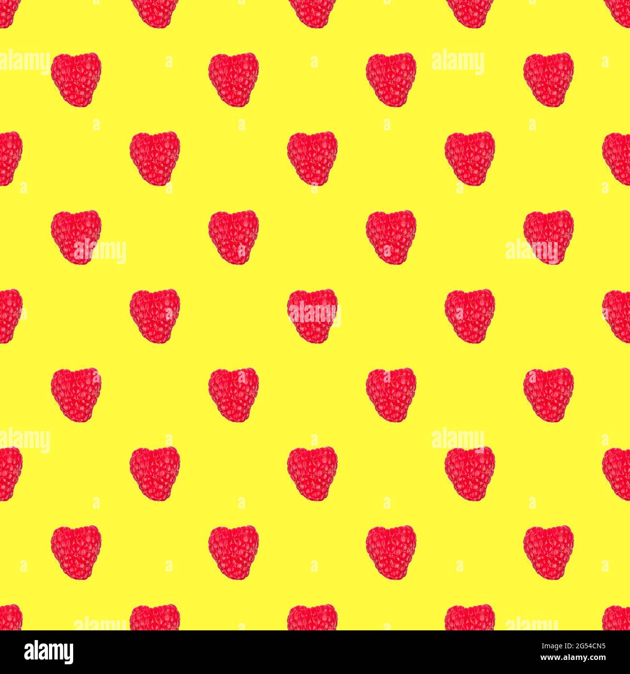 seamless pattern with red raspberries isolated on a yellow background Stock Photo
