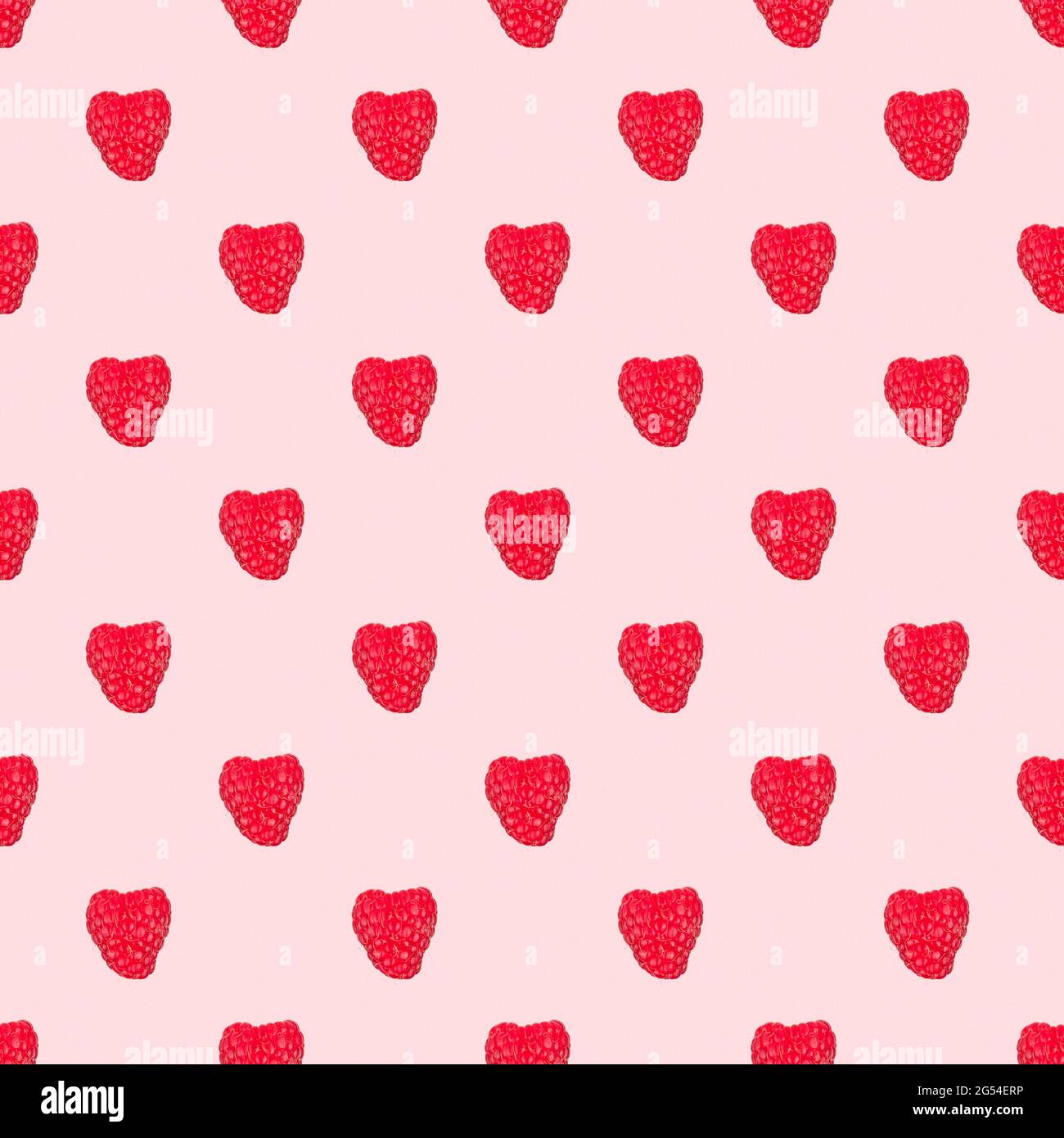 seamless pattern with red raspberries isolated on a pink background Stock Photo