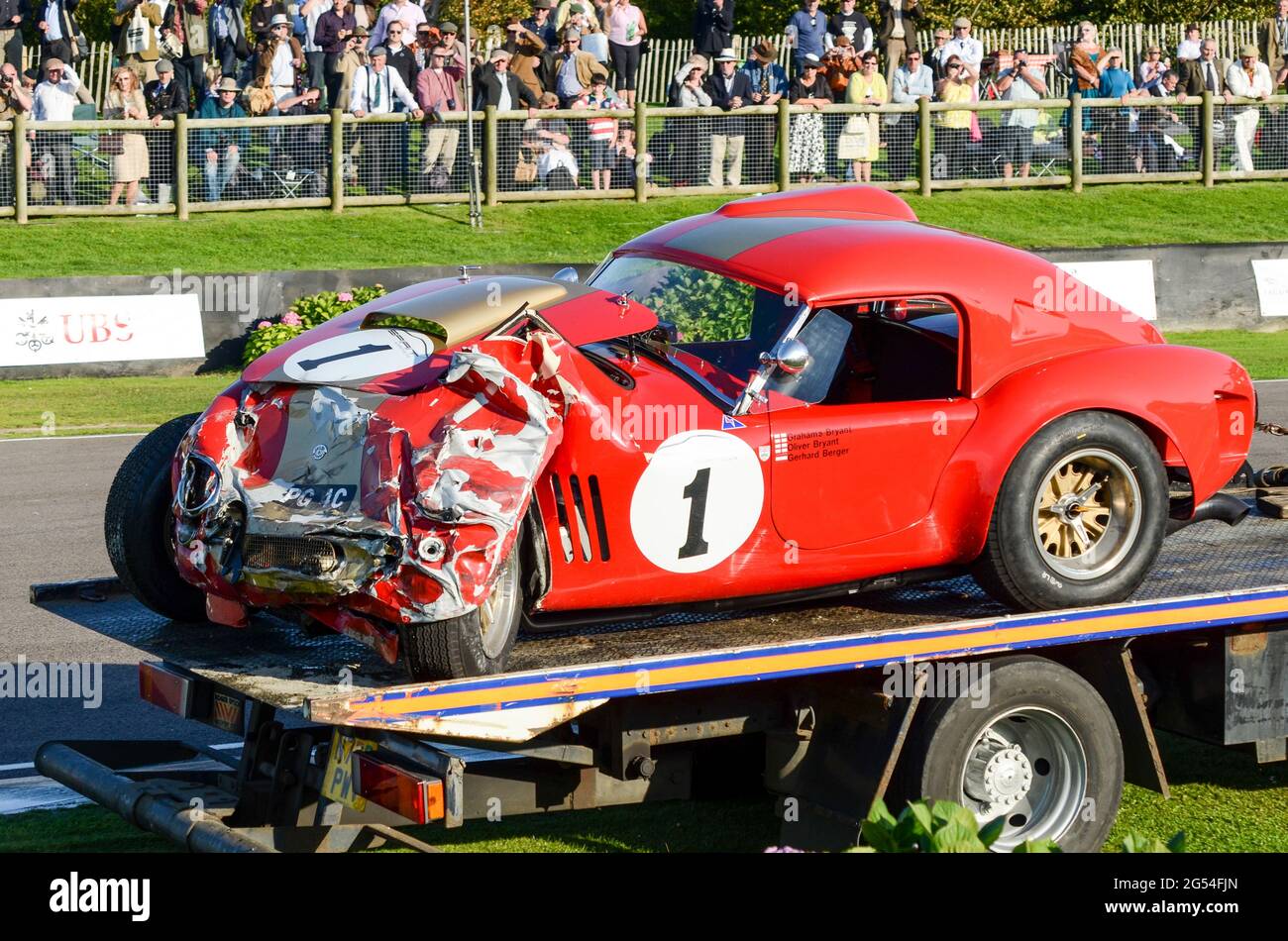 Shelby AC Cobra classic racing car being transported away following crashing during racing at the Goodwood Revival 2011, UK. Smashed front Stock Photo