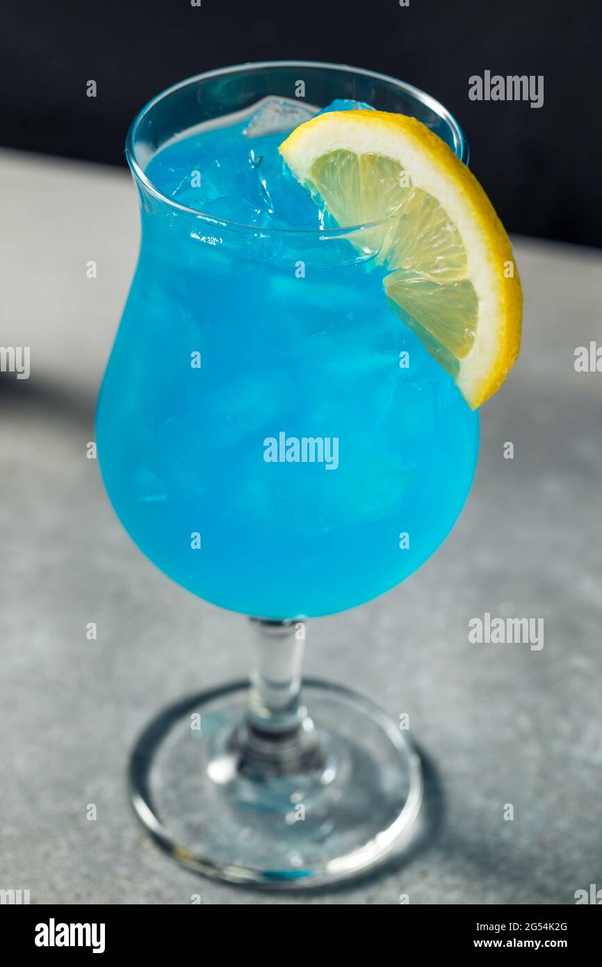 Refreshing Boozy Blue Hawaii Cocktail with Lemon Stock Photo