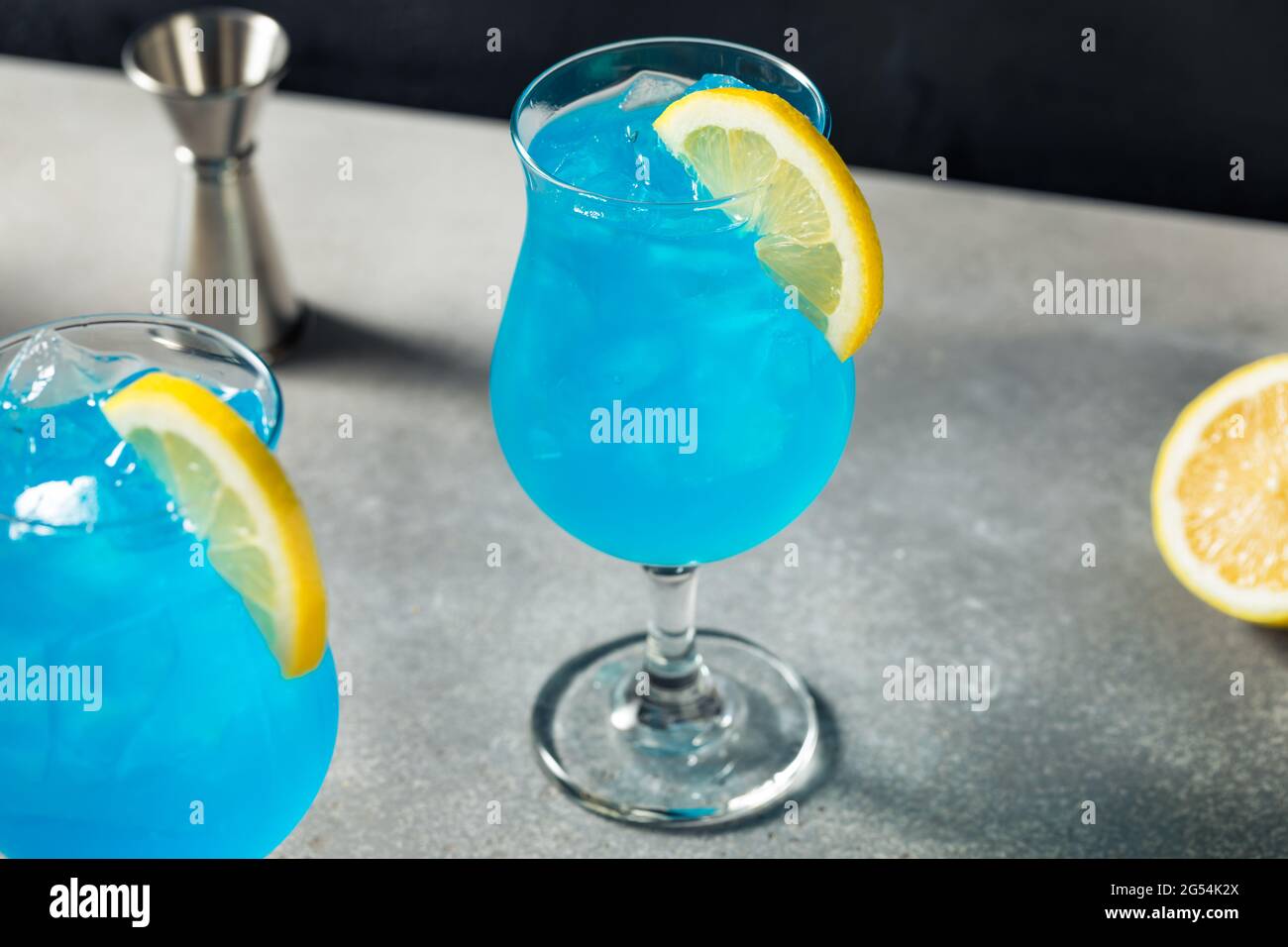 Refreshing Boozy Blue Hawaii Cocktail with Lemon Stock Photo