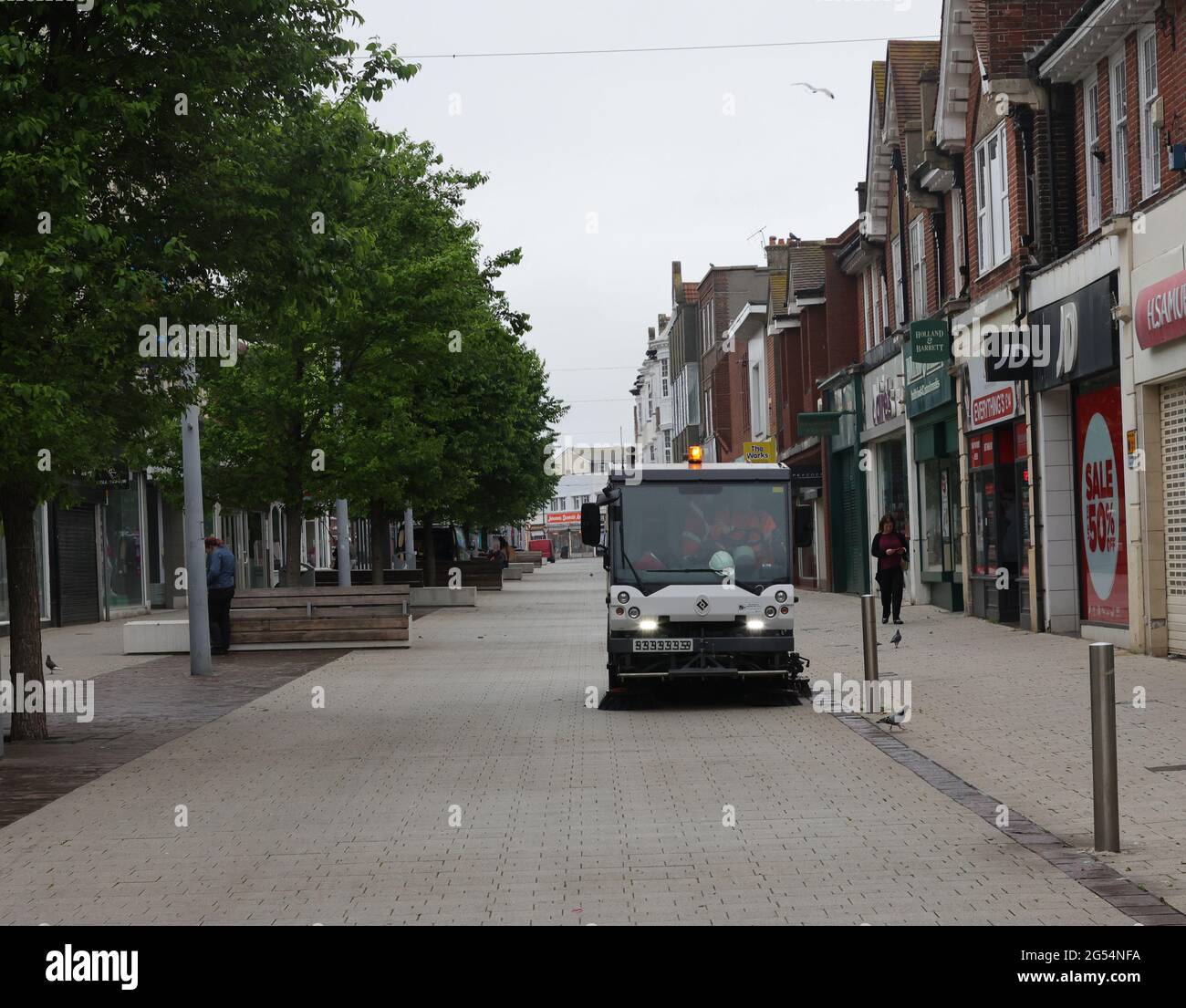 Street cleaning in progress on the main pedestrian shopping road in