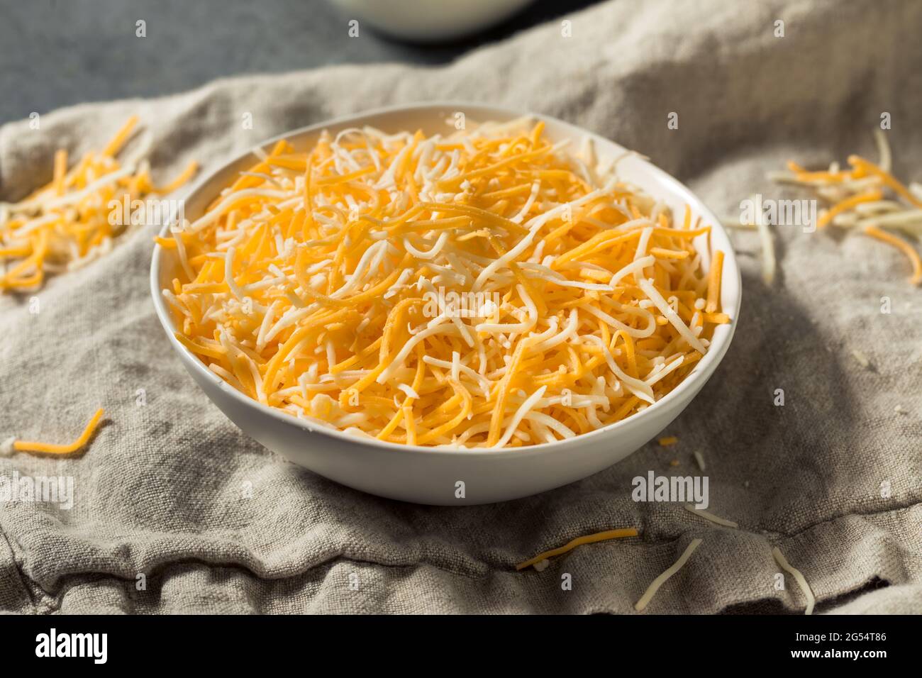 Organic Shredded Mexican Cheese Mix in a Bowl Stock Photo