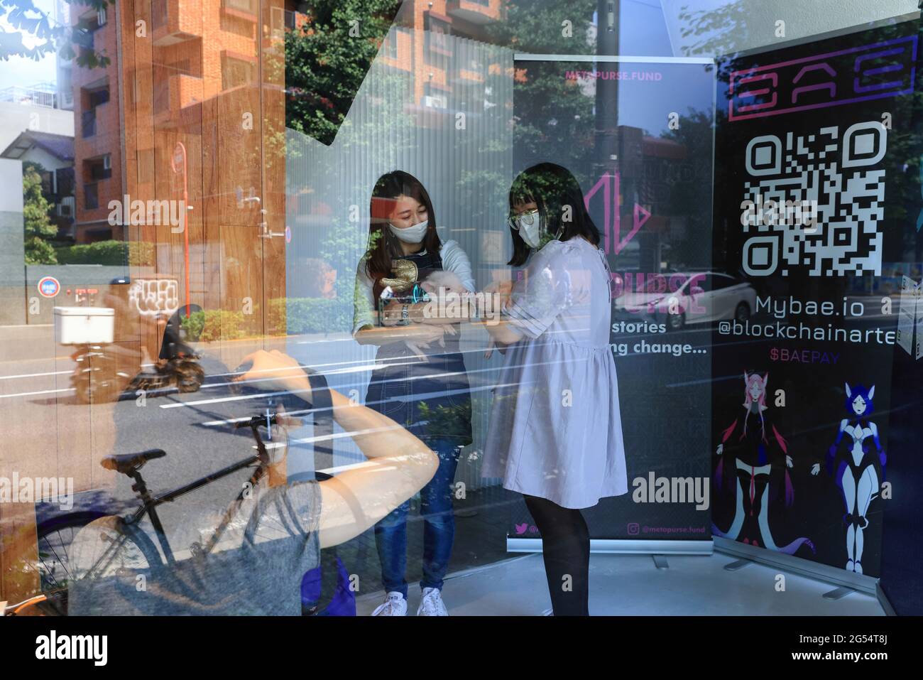 Tokyo, Japan. 25th June, 2021. Representatives of MYBAE.IO take promotional  pictures day before the opening of CrypTOKYO Blockchain Art Exhibition 2021  in UltraSuperNew Gallery in Shibuya City. MYBAE.IO is an open market