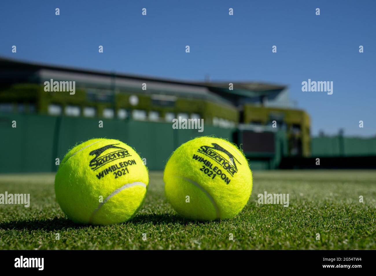 The official Slazenger tennis balls for this year's championships  photographed on court at The All England Lawn Tennis and Croquet Club.  Picture date: Wednesday June 16, 2021 Stock Photo - Alamy