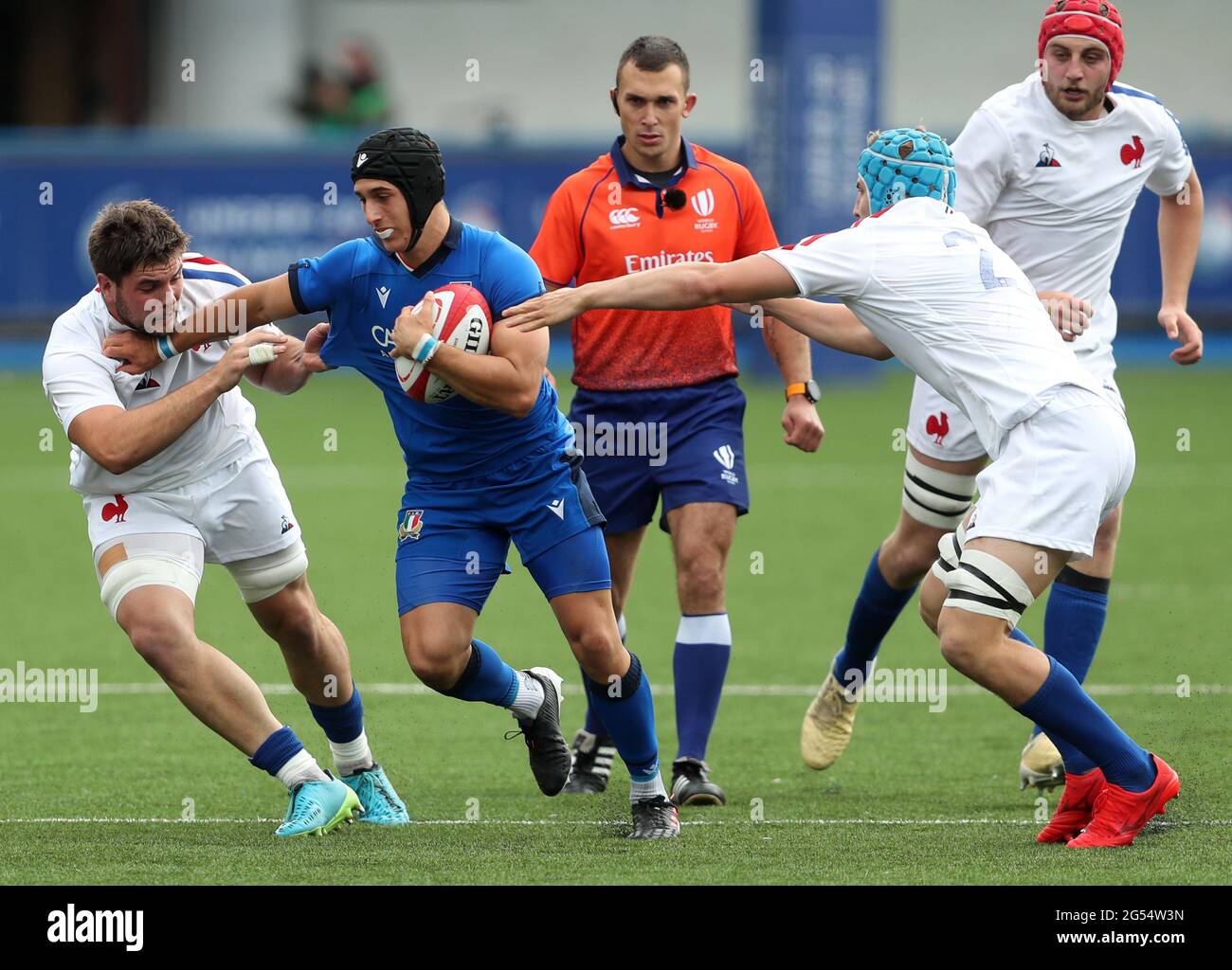 Italy's Simone Gesi (centre) tackled by France's Jean-Baptiste Lachaise and  Maxime Baudonne during the Under 20s Six Nations match at Cardiff Arms  Park, Cardiff. Picture date: Friday June 25, 2021 Stock Photo -