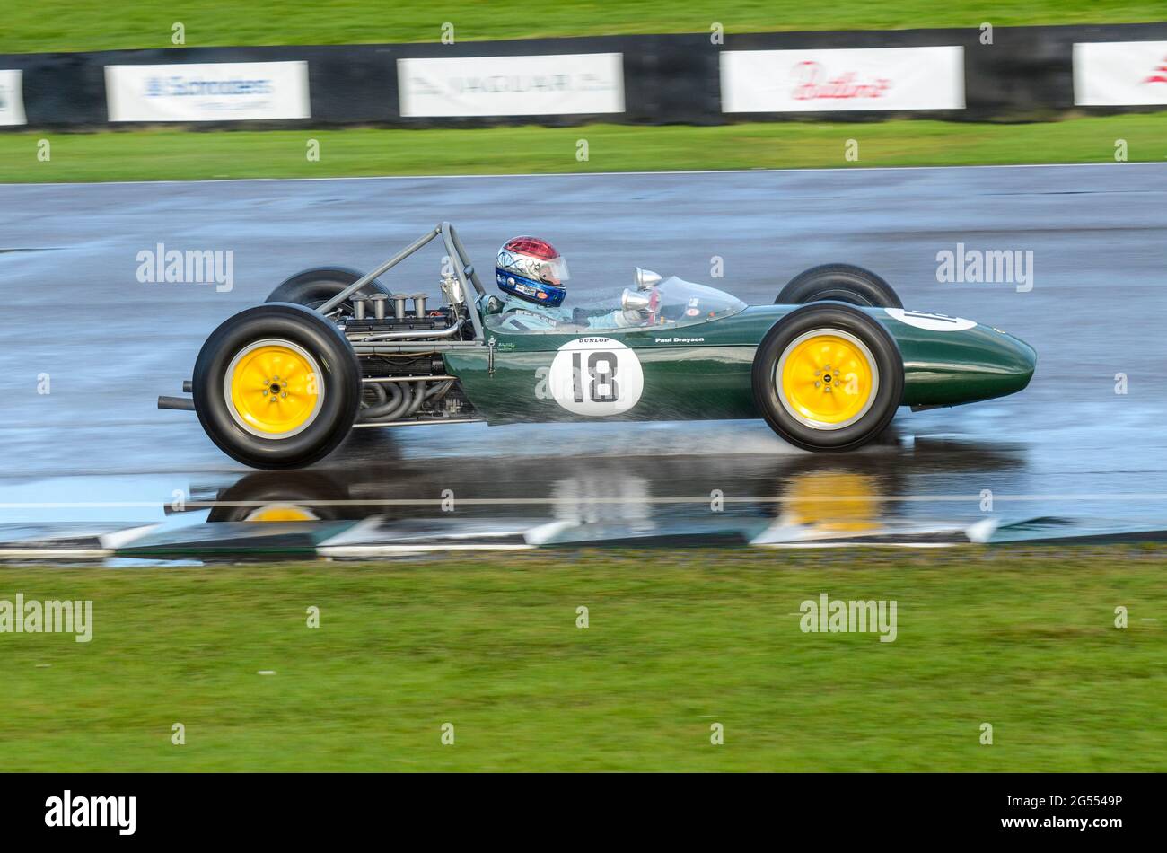 Classic Lotus BRM 24 racing car racing in the Glover Trophy at the Goodwood Revival 2011, on a wet track after rain. Vintage Grand Prix car Stock Photo
