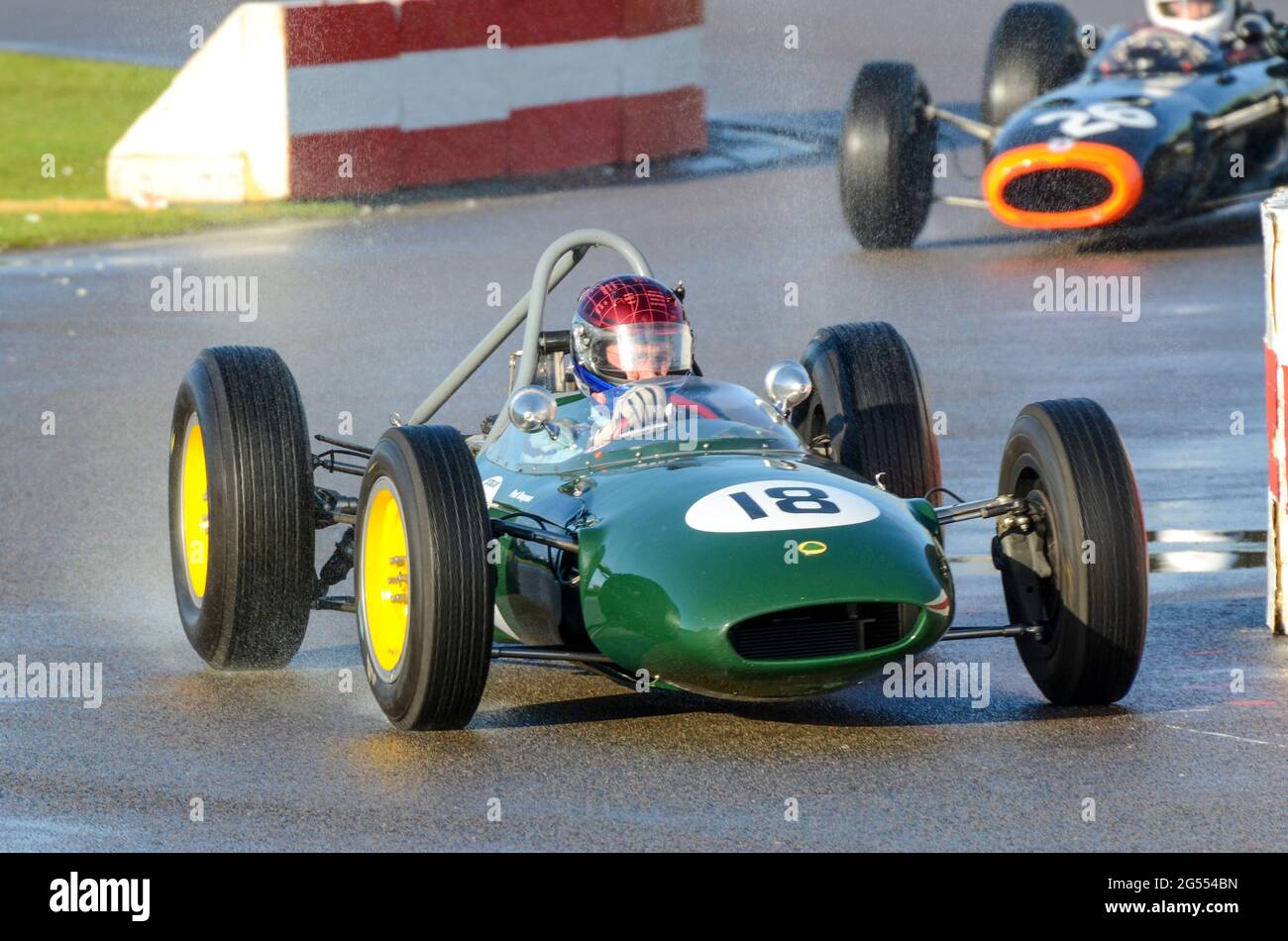 Classic Lotus BRM 24 racing car racing in the Glover Trophy at the Goodwood Revival 2011, on a wet track after rain. Vintage Grand Prix car Stock Photo