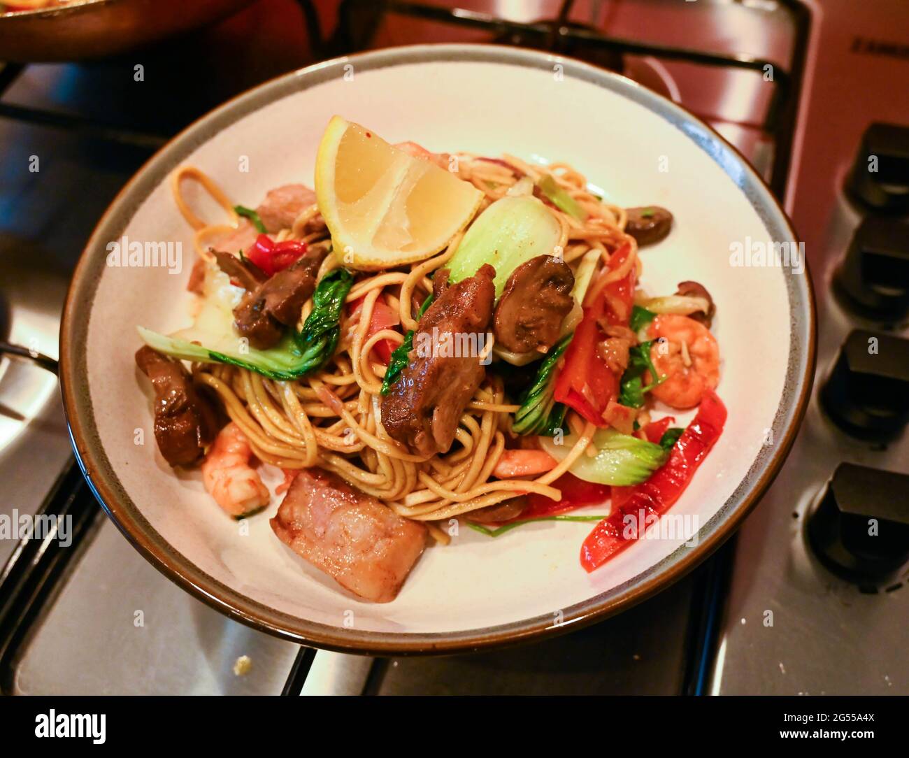 Home cooking stir fry Singapore Noodles with pork , prawns and egg