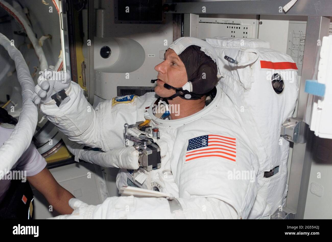 ONBOARD SPACE SHUTTLE DISCOVERY - 08 July 2006 - Astronaut Piers J Sellers, STS-121 mission specialist, attired in his Extravehicular Mobility Unit (E Stock Photo