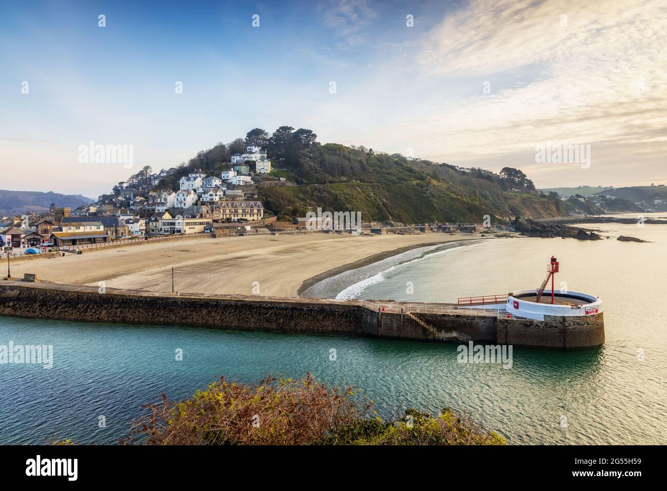 The Banjo Pier, named because of its banjo shape, and beach at Looe in Cornwall, taken shortly after sunrise. Stock Photo