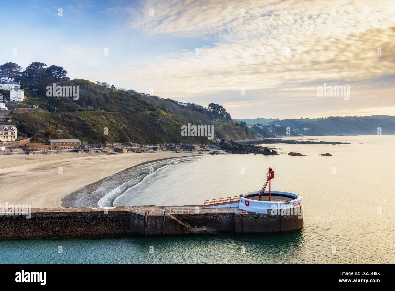 The Banjo Pier, named because of its banjo shape, and beach at Looe in Cornwall, taken shortly after sunrise. Stock Photo