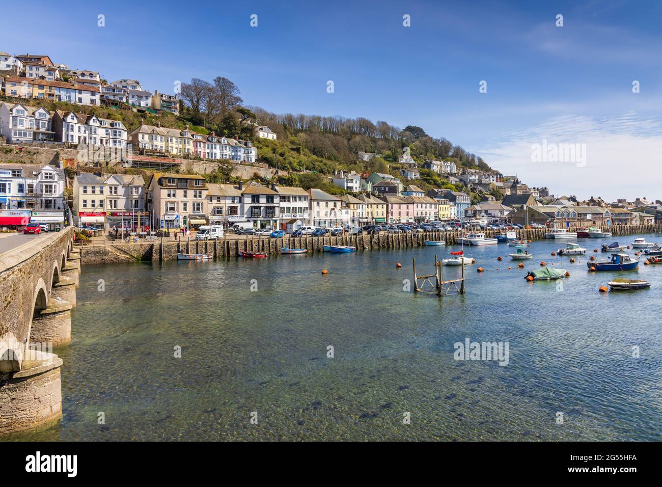 Boats moored on the Looe River in Cornwall. Looe is a very popular holiday resort, and is also notable for its fish market and numerous fishing boats. Stock Photo