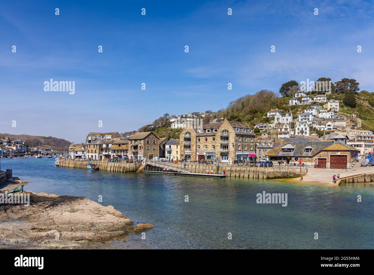 The Looe River and East Looe riverside in Cornwall. On the left is the memorial to Nelson, the one eyed seal. Stock Photo