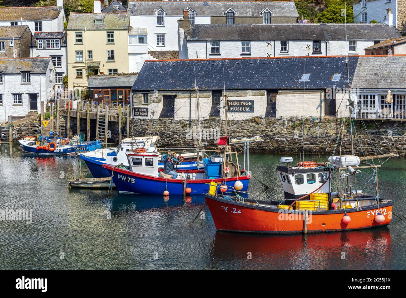 Fishing boats moored in the harbour at Polperro, a charming and picturesque fishing village in south east Cornwall. Stock Photo