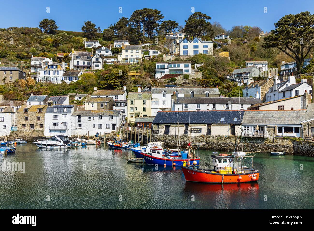 Fishing boats in the harbour at Polperro, a charming and picturesque fishing village in south east Cornwall. Stock Photo