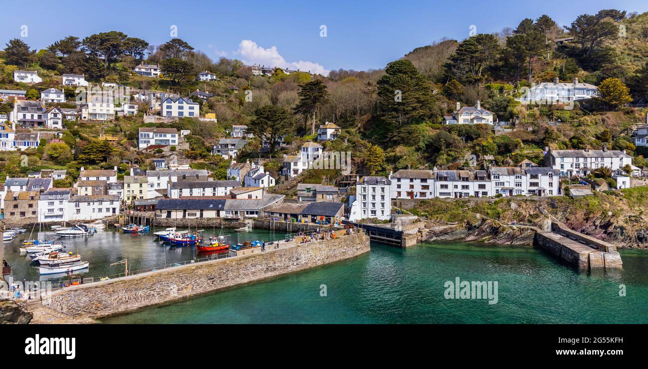 The charming and picturesque fishing village of Polperro in south east Cornwall, with its harbour wall and narrow entrance to the inner harbour. Stock Photo