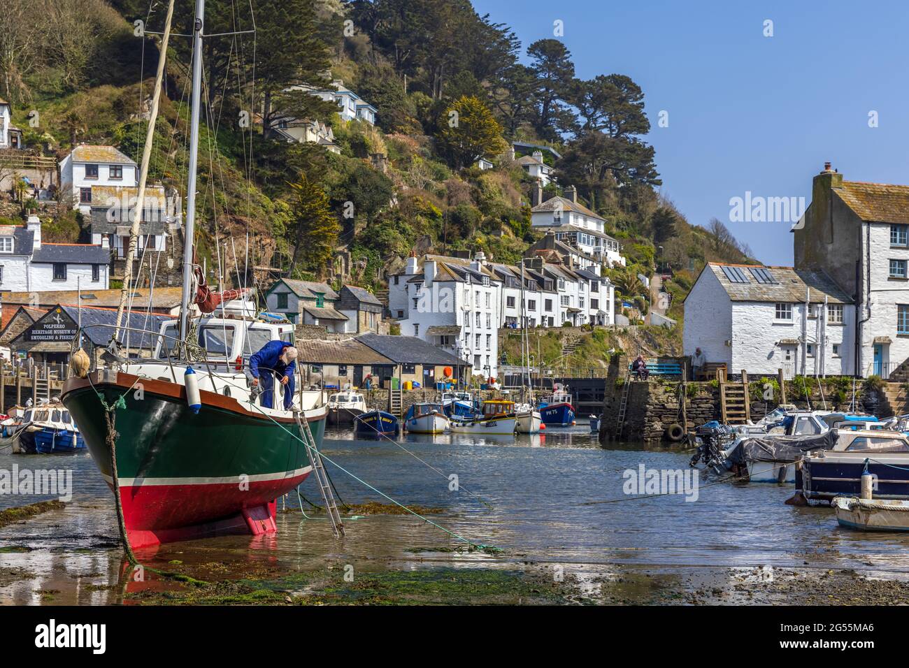 Boat maintenance at Polperro, a charming and picturesque fishing village in south east Cornwall.  It is a truly delightful place to visit. Stock Photo