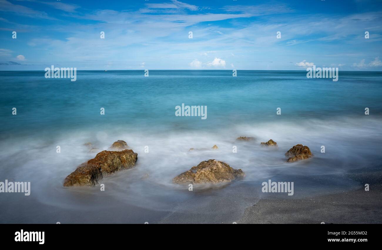 Long exposure of rocks on the shore of the  Gulf of Mexico at Caspersen Beach in Venice Florida in the USA Stock Photo