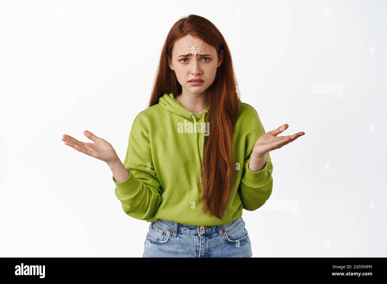 Portrait Of Confused Redhead Girl Asking Whats Wrong Cant Understand Something Looking